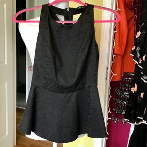 Black peplum top with detailed back